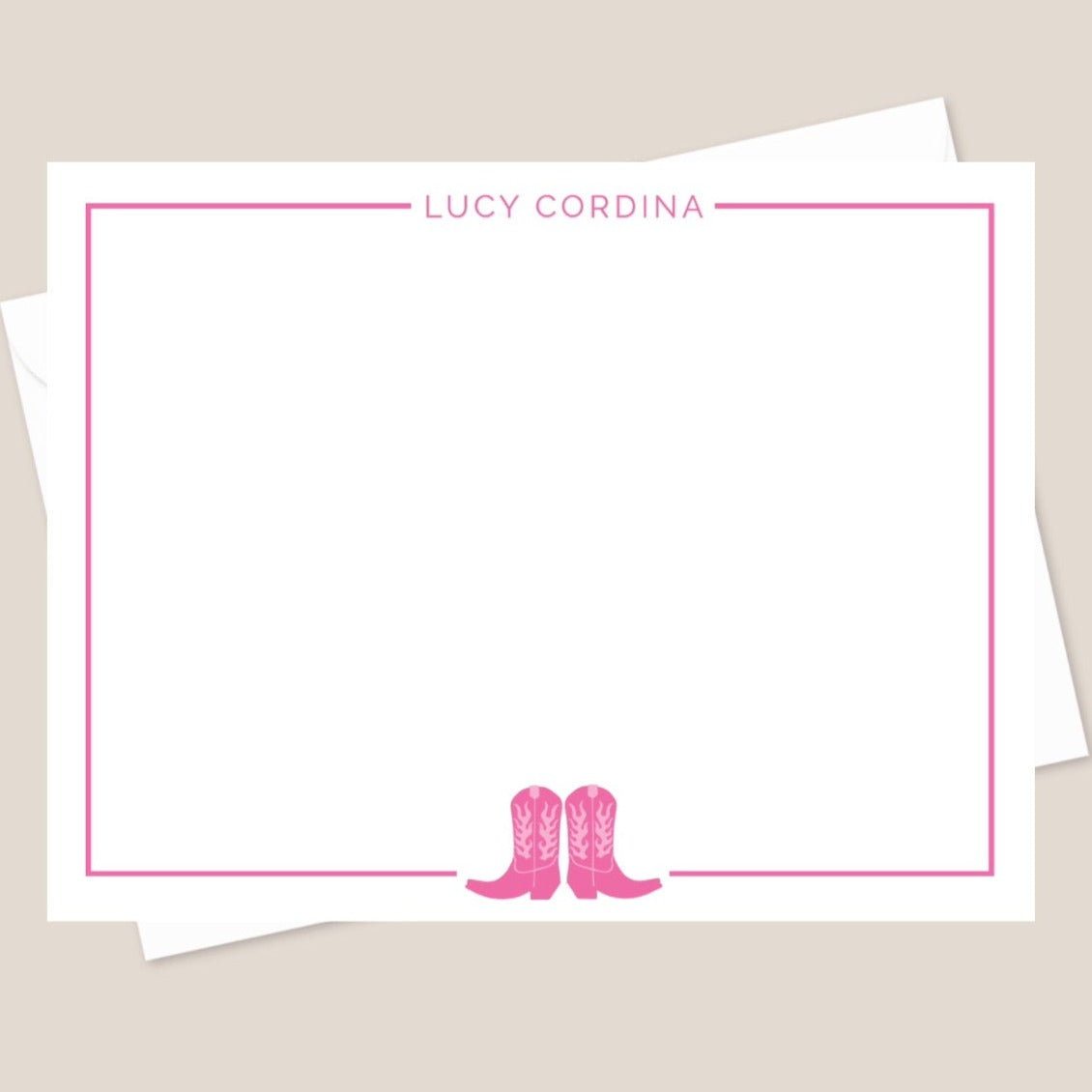 A personalized flat note card with a pink border and a pair of pink boots illustration at the bottom, featuring the name 'Lucy Cordina' at the top.