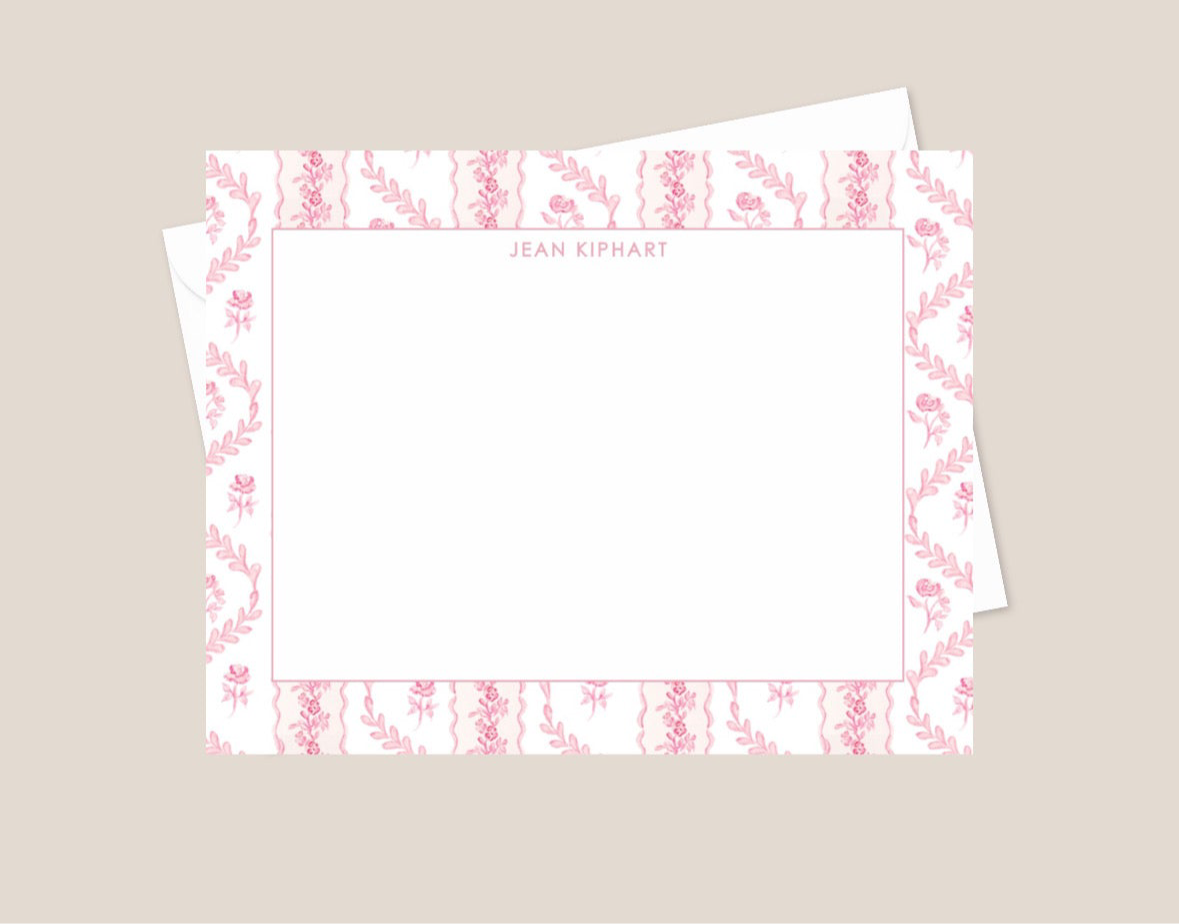 Set of stationery with floral border design on a beige background