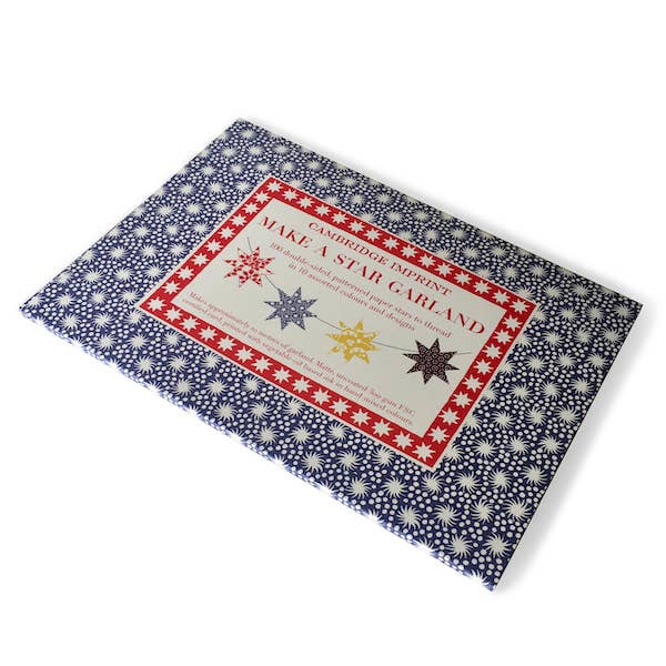Packaging for a star garland kit with decorative patterns on a white background