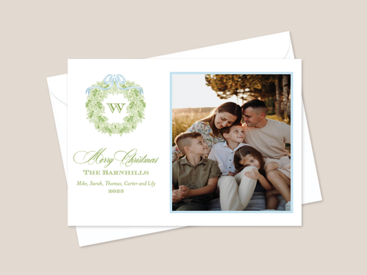 Christmas card with family photo and decorative wreath and bow design