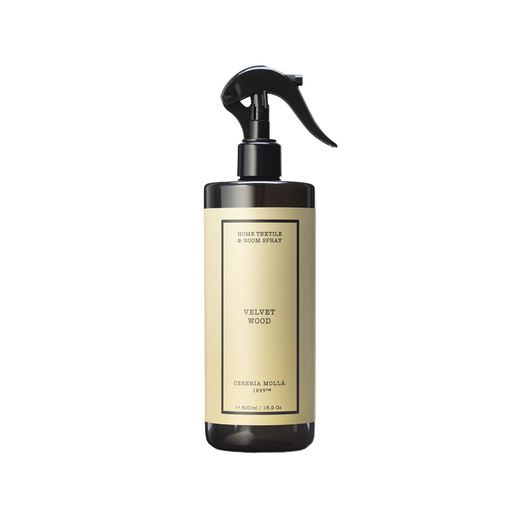 Room spray bottle labeled 'Velvet Wood' on a white background
