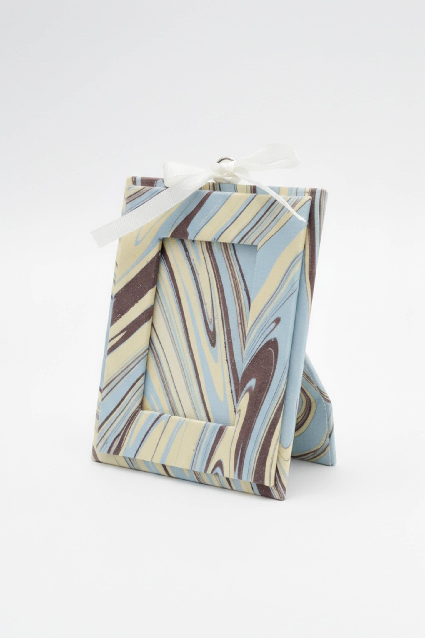 Marbled patterned gift bag on a white background