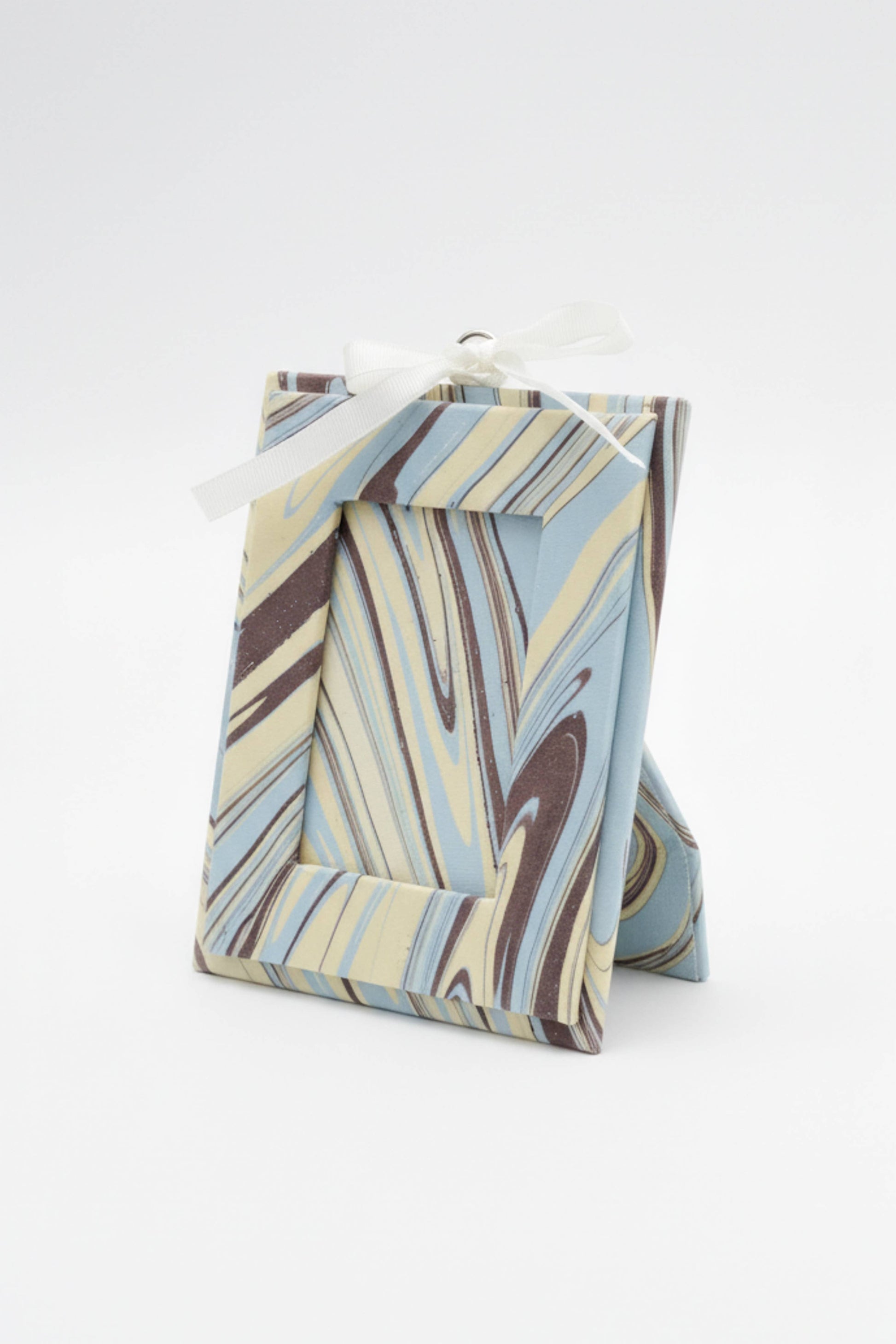 Marbled patterned gift bag on a white background